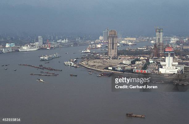 View over the Huangpu River and Pudong, as seen from Shanghai. The construction of the Oriental TV Tower had just started in Pudong.