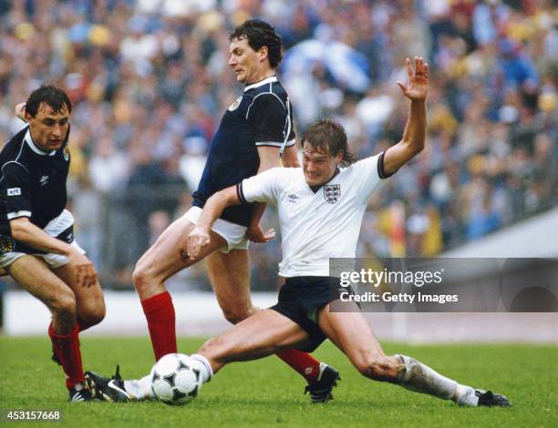 England player Glenn Hoddle challenges Jim Bett of Scotland as Maurice Malpas looks on during a Home international match between Scotland and England...