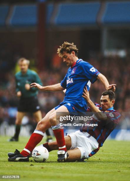 Chelsea player Glenn Hoddle is challenged by Guy Whittingham of Aston Villa during a Premiership match between Aston Villa and Chelsea at Villa Park...