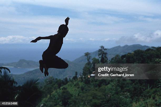 Boy jumps into a pool, 15km south of the capital Dili.