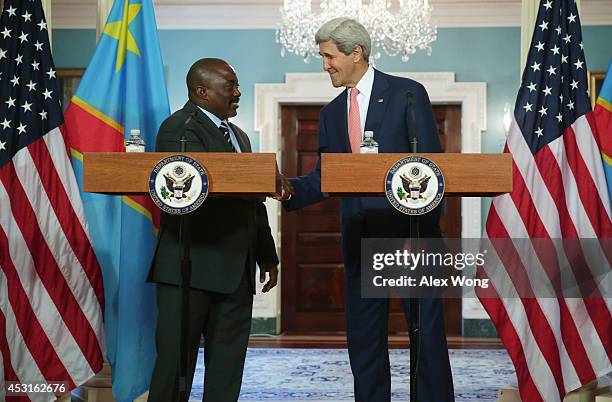 President of the Democratic Republic of Congo Joseph Kabila and U.S. Secretary of State John Kerry shake hands before a bilateral meeting during the...