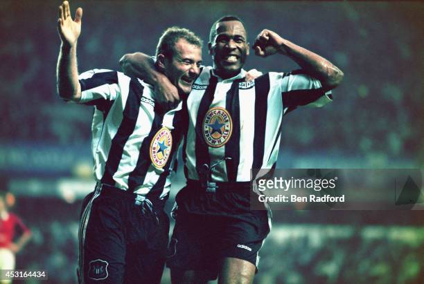 Newcastle strikers Alan Shearer and Les Ferdinand celebrate a goal during the Premiership match between Newcastle United and Manchester United at St...