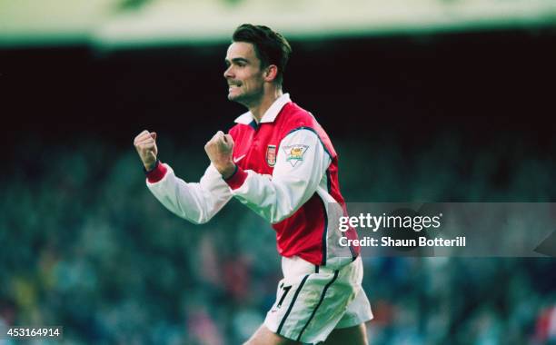 Arsenal player Marc Overmars celebrates scoring the 'winning goal' in the FA Cup 5th Round match between Arsenal and Sheffield United at Highbury....