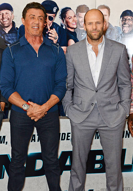 Sylvester Stallone and Jason Statham attend a photocall for "The Expendables 3" at the Corinthia Hotel London on August 4, 2014 in London, England.