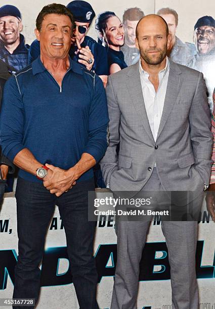 Sylvester Stallone and Jason Statham attend a photocall for "The Expendables 3" at the Corinthia Hotel London on August 4, 2014 in London, England.
