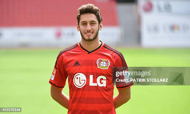 Leverkusen's midfielder Hakan Calhanoglu poses during the team presentation of the German first division Bundesliga team Bayer 04 Leverkusen at the...