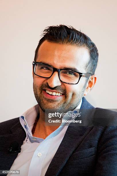 Ashish Thakkar, founder and chief executive officer of Mara Group, smiles during a forum on African energy and innovation at the Newseum in...