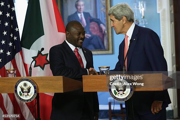 President of Burundi Pierre Nkurunziza and U.S. Secretary of State John Kerry shake hands before a bilateral meeting during the U.S.-Africa Leaders...