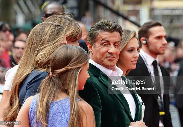 Sylvester Stallone poses with wife Jennifer Flavin and daughters Scarlet, Sophia and Sistine attend the World Premiere of "The Expendables 3" at...