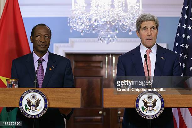 Burkina Faso President Blaise Campaore and U.S. Secretary of State John Kerry deliver brief remarks to the news media before a bilateral meeting...