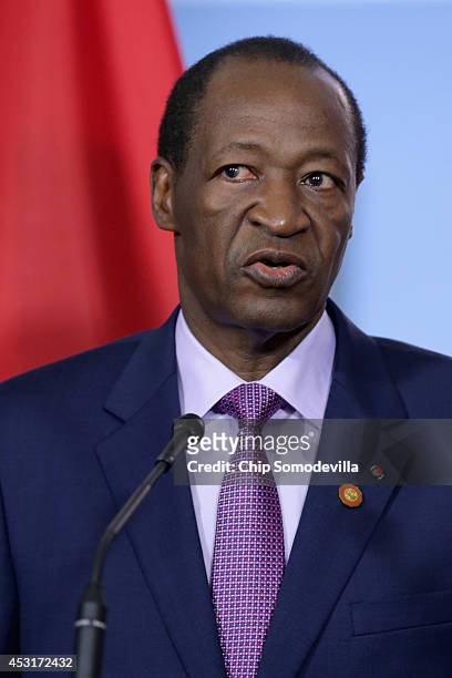 Burkina Faso President Blaise Campaore delivers brief remarks to the news media before a bilateral meeting with U.S. Secretary of State John Kerry...