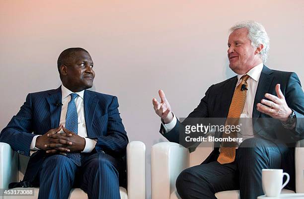 Aliko Dangote, president of Dangote Group, right, listens to Jeffrey Immelt, chairman and chief executive officer of General Electric Co., during a...