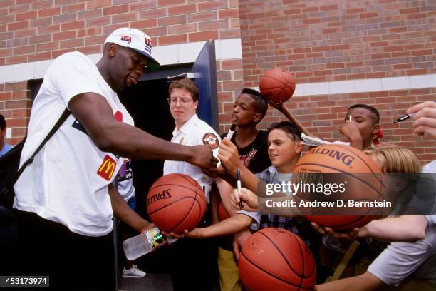 Shawn Kemp of the USA Men's National Team signs autographs for fans after practice in 1994 at the Solheim Center of the Moody Bible Institute in...