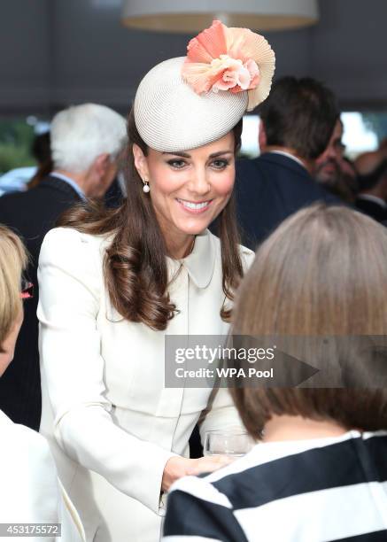 Catherine, Duchess of Cambridge speaks to guests after a ceremony at St Symphorien Military Cemetery on August 4, 2014 in Mons, Belgium. Monday 4th...