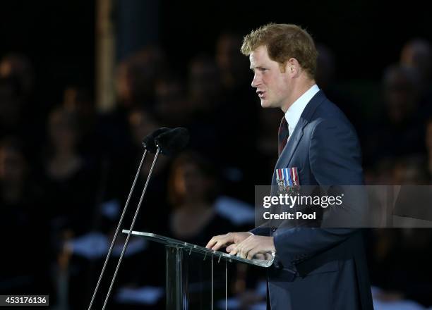 Prince Harry delivers a speech during a ceremony at St Symphorien Military Cemetery on August 4, 2014 in Mons, Belgium. Monday 4th August marks the...