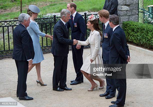 Catherine, Duchess of Cambridge greets King Philippe of Belgium at St Symphorien Military Cemetery on August 4, 2014 in Mons, Belgium. Monday 4th...