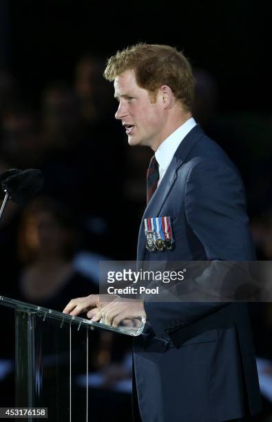 Prince Harry delivers a speech during a ceremony at St Symphorien Military Cemetery on August 4, 2014 in Mons, Belgium. Monday 4th August marks the...