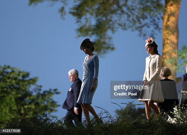 Catherine, Duchess of Cambridge and Queen Mathilde of Belgium during a ceremony at St. Symphorien Military Cemetery on August 4, 2014 in Mons,...