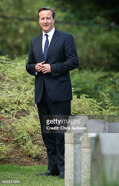 Prime Minister David Cameron looks at war graves at St Symphorien Military Cemetery on August 4, 2014 in Mons, Belgium. Monday 4th August marks the...
