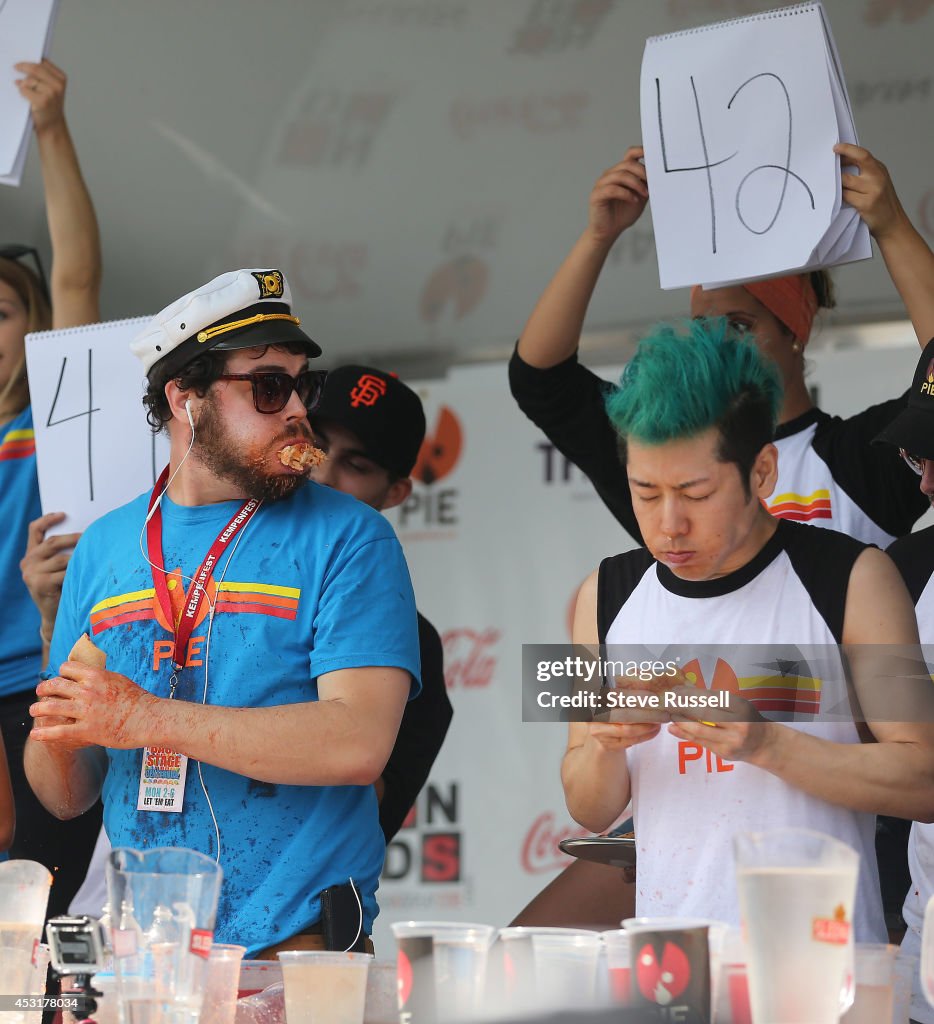 Takeru Kobayashi defends his pizza eating title at "Let Them Eat 5" During Kempenfest on the waterfront in Barrie, Ontario, Canada.  Kobayashi ate 62 slices of pizza, (15 and a half 12" pizzas, that weigh about a pound each)