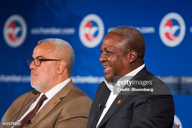 John Dramani Mahama, president of Ghana, right, laughs during a panel discussion with Abdelilah Benkirane, prime minister of Morocco, at the U.S....
