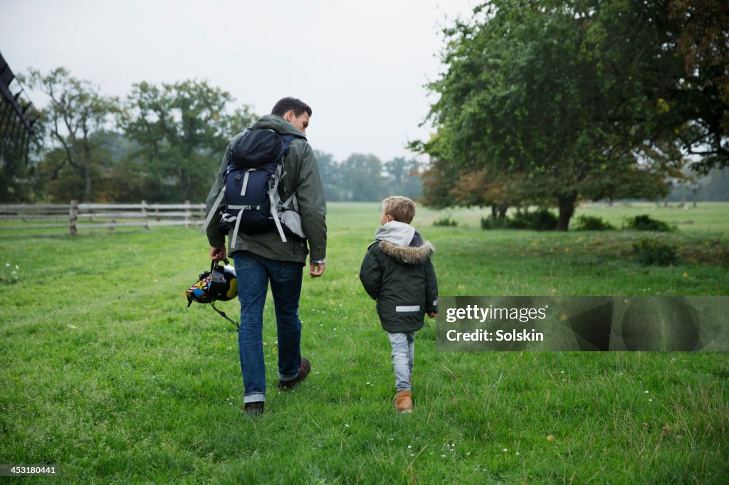 Father and son walking in nature