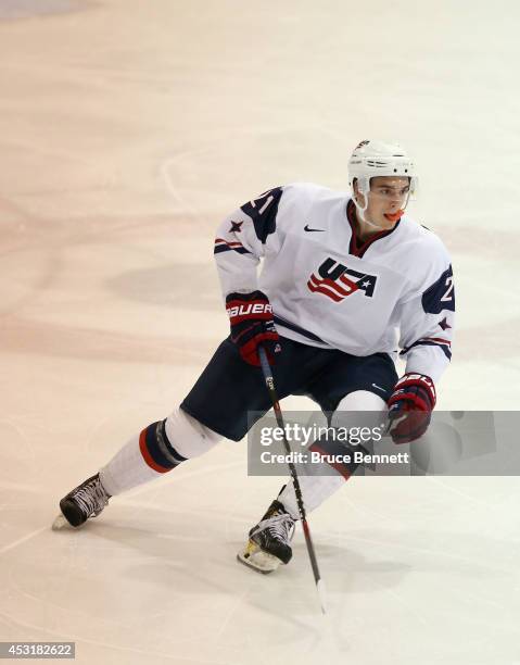 Dominic Turgeon of USA White skates against Team Finland during the 2014 USA Hockey Junior Evaluation Camp at the Lake Placid Olympic Center on...