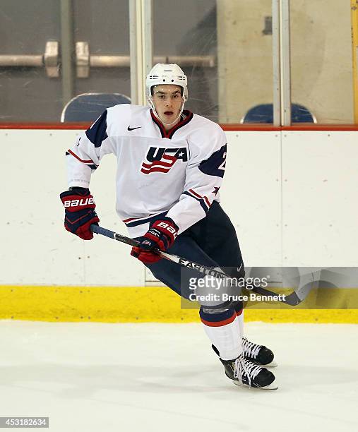 Dominic Turgeon of USA White skates against Team Finland during the 2014 USA Hockey Junior Evaluation Camp at the Lake Placid Olympic Center on...