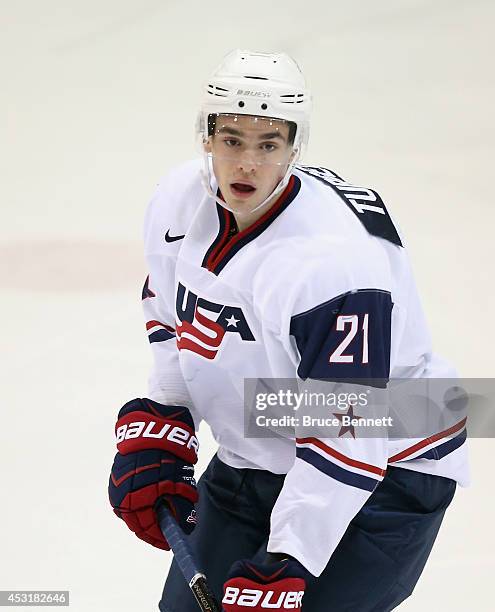 Dominic Turgeon of USA White skates against Team Finland during the 2014 USA Hockey Junior Evaluation Camp at the Lake Placid Olympic Center on...