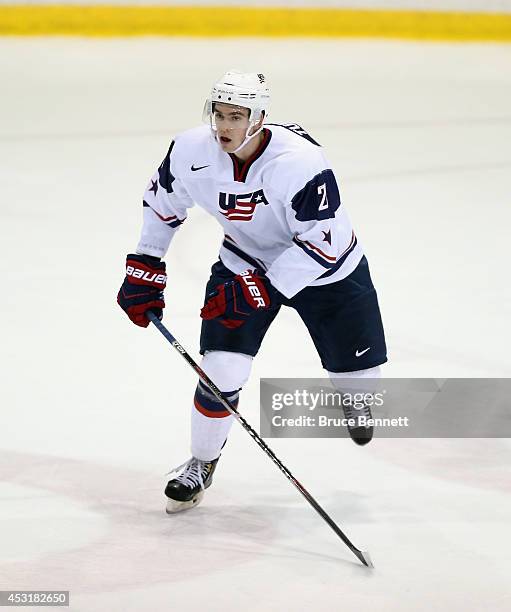 Dominic Turgeon of USA White skates against Team Finland during the 2014 USA Hockey Junior Evaluation Camp at the Lake Placid Olympic Center on...