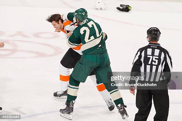 Mike Rupp of the Minnesota Wild fights with Jay Rosehill of the Philadelphia Flyers during the game on December 2, 2013 at the Xcel Energy Center in...