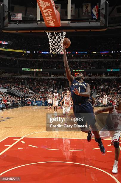 Tyreke Evans of the New Orleans Pelicans goes to the basket past Mike James of the Chicago Bulls on December 2, 2013 at the United Center in Chicago,...