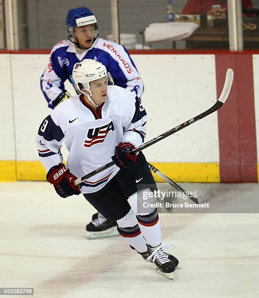 Ryan Hitchcock of USA White skates against Team Finland during the 2014 USA Hockey Junior Evaluation Camp at the Lake Placid Olympic Center on August...