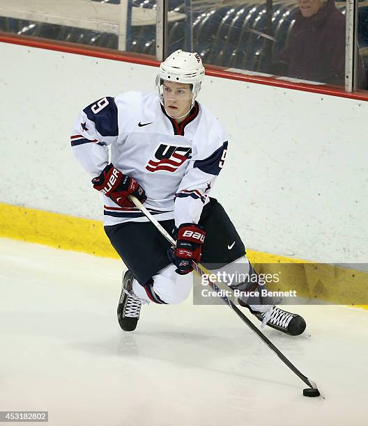 Ryan Hitchcock of USA White skates against Team Finland during the 2014 USA Hockey Junior Evaluation Camp at the Lake Placid Olympic Center on August...