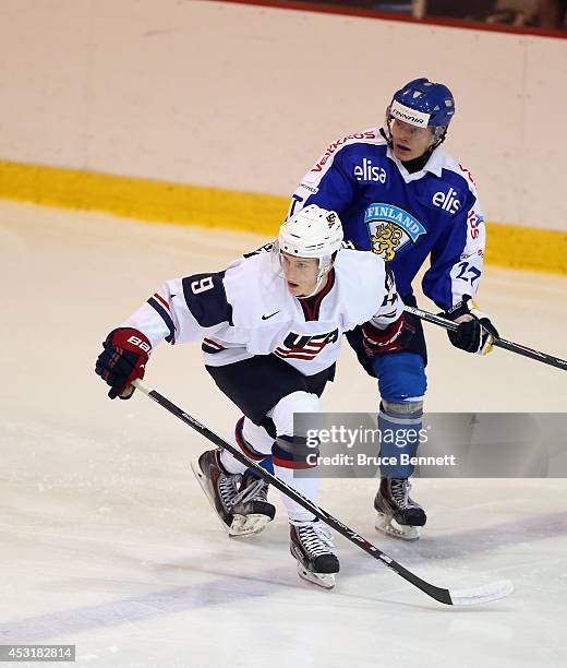 Ryan Hitchcock of USA White skates against Team Finland during the 2014 USA Hockey Junior Evaluation Camp at the Lake Placid Olympic Center on August...