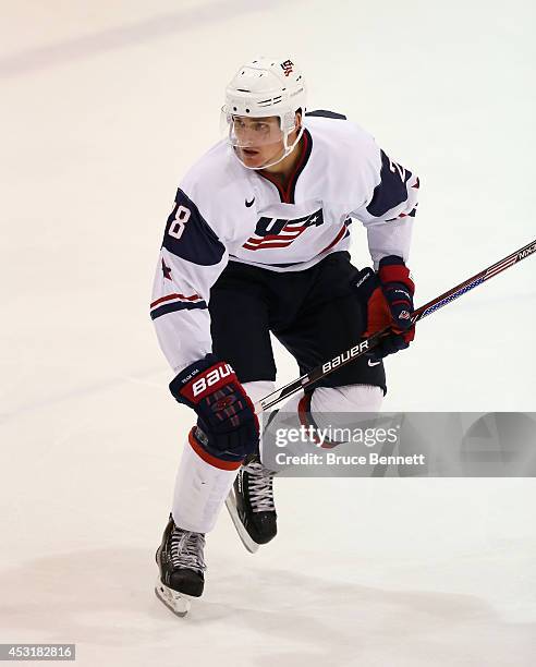 Clint Lewis of USA White skates against Team Finland during the 2014 USA Hockey Junior Evaluation Camp at the Lake Placid Olympic Center on August 4,...