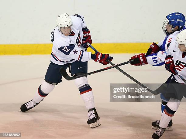 Mike McCarron of USA White skates against Team Finland during the 2014 USA Hockey Junior Evaluation Camp at the Lake Placid Olympic Center on August...