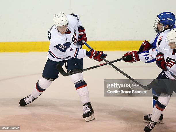 Mike McCarron of USA White skates against Team Finland during the 2014 USA Hockey Junior Evaluation Camp at the Lake Placid Olympic Center on August...