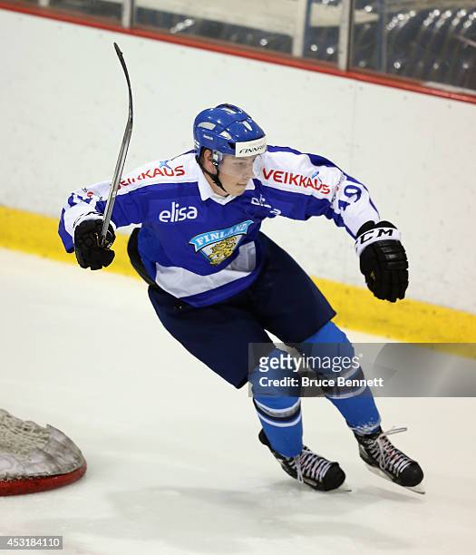 Julius Vahatalo of Team Finland skates against USA White during the 2014 USA Hockey Junior Evaluation Camp at the Lake Placid Olympic Center on...