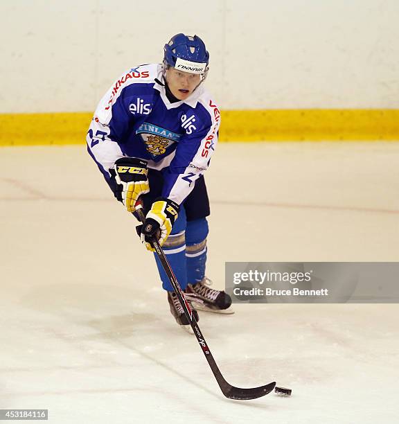 Erik Autio of Team Finland skates against USA White during the 2014 USA Hockey Junior Evaluation Camp at the Lake Placid Olympic Center on August 4,...