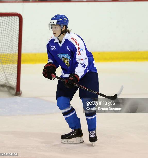 Sami Niku of Team Finland skates against USA White during the 2014 USA Hockey Junior Evaluation Camp at the Lake Placid Olympic Center on August 4,...