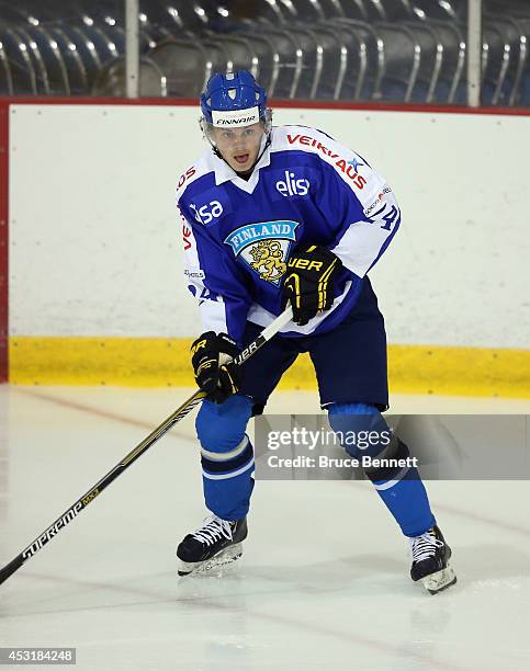 Kasperi Kapanen of Team Finland skates against USA White during the 2014 USA Hockey Junior Evaluation Camp at the Lake Placid Olympic Center on...