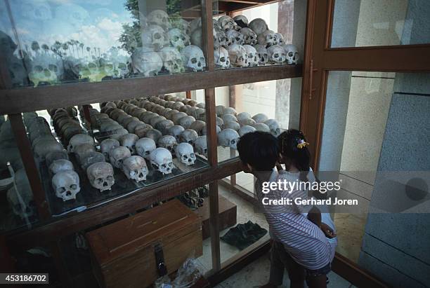 Skulls gathered in a monument to mark the Khmer Rouge genocide at the Killing Fields outside Phnom Penh.