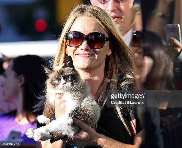 Grumpy Cat and Tabatha Bundesen arrive at "The Grumpy Guide To Life: Observations By Grumpy Cat" Book Launch Party at Kitson on August 4, 2014 in...
