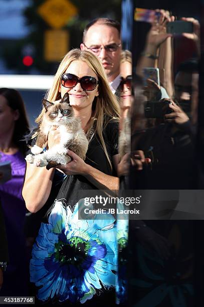 Grumpy Cat, Bryan Bundesen and Tabatha Bundesen arrive at "The Grumpy Guide To Life: Observations By Grumpy Cat" Book Launch Party at Kitson on...
