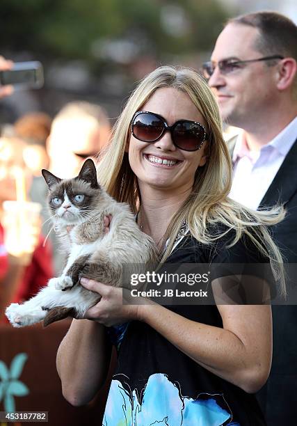 Grumpy Cat, Bryan Bundesen and Tabatha Bundesen arrive at "The Grumpy Guide To Life: Observations By Grumpy Cat" Book Launch Party at Kitson on...