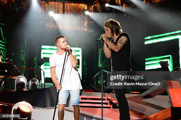 Liam Payne and Harry Styles of One Direction perform onstage during the "Where We Are" tour at Met Life Stadium on August 4, 2014 in New York City.