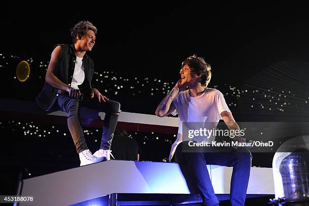 Niall Horan and Louis Tomlinson of One Direction perform onstage during the "Where We Are" tour at Met Life Stadium on August 4, 2014 in New York...