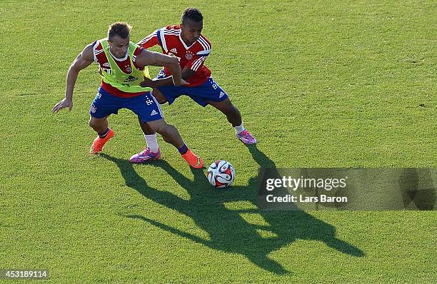 Xherdan Shaqiri is challenged by Julian Green during a Bayern Muenchen training session at day six of the Audi Summer Tour USA 2014 on August 4, 2014...