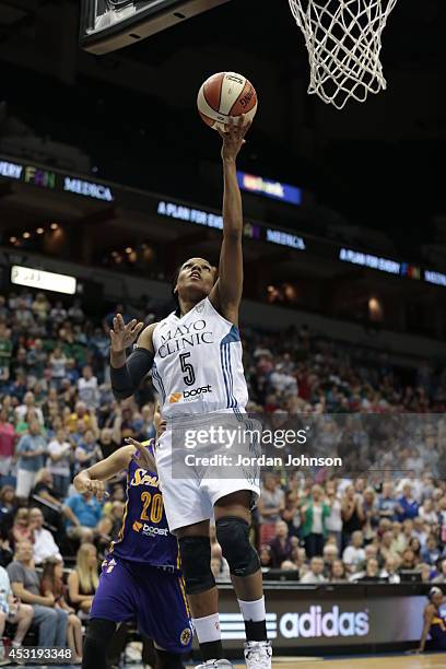 Tan White of the Minnesota Lynx drives to the basket against the Los Angeles Sparks during the WNBA game on July 8, 2014 at Target Center in...